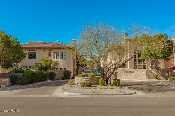 a view of house with swimming pool outdoor seating