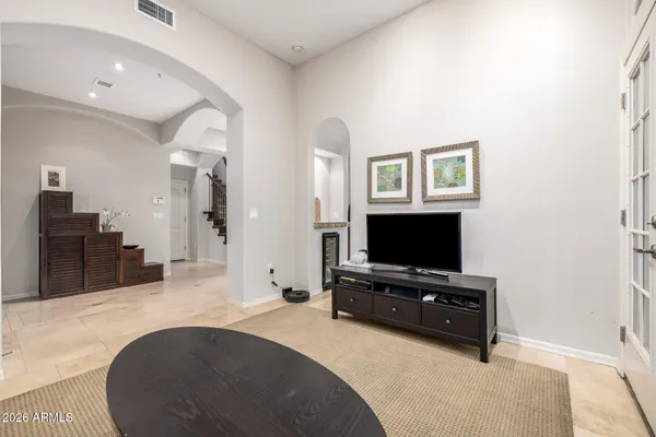 wooden floor in a room with a book shelf