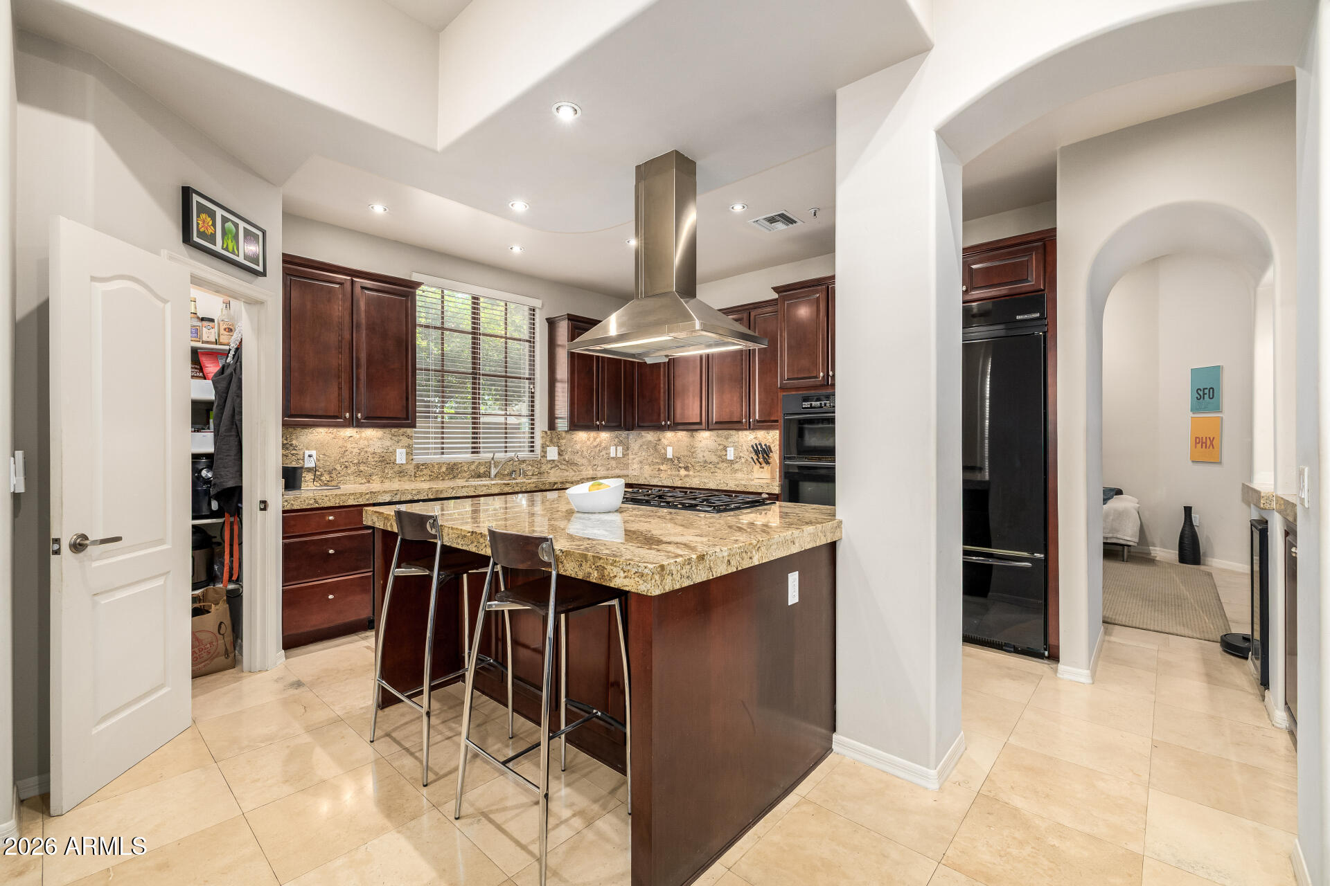 4430 North 22nd Street, Unit 3 Phoenix, AZ 85016 - Photo 17 of 68 a kitchen with stainless steel appliances kitchen island granite countertop a refrigerator and a sink