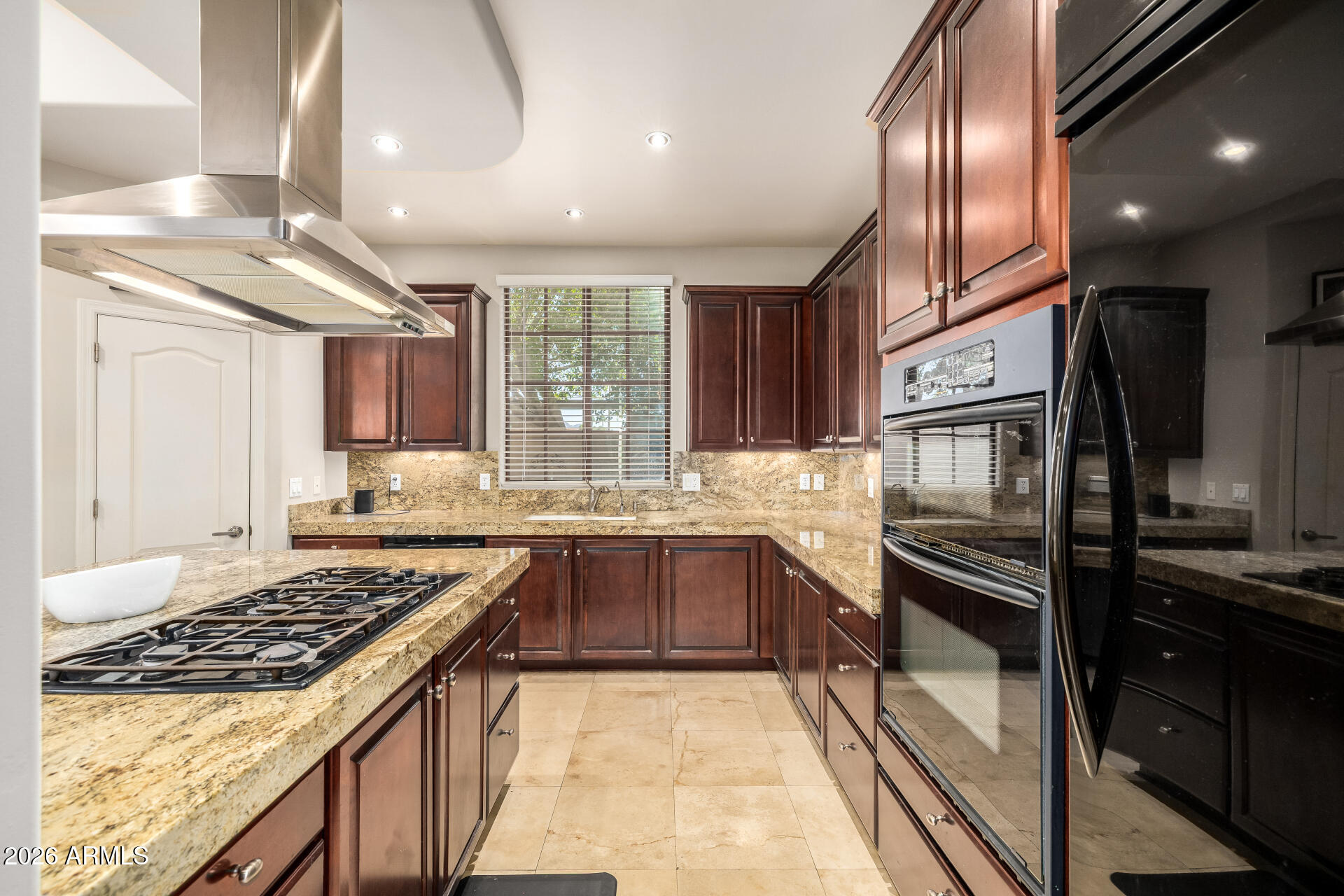 4430 North 22nd Street, Unit 3 Phoenix, AZ 85016 - Photo 20 of 68 a kitchen with stainless steel appliances granite countertop a sink stove and refrigerator