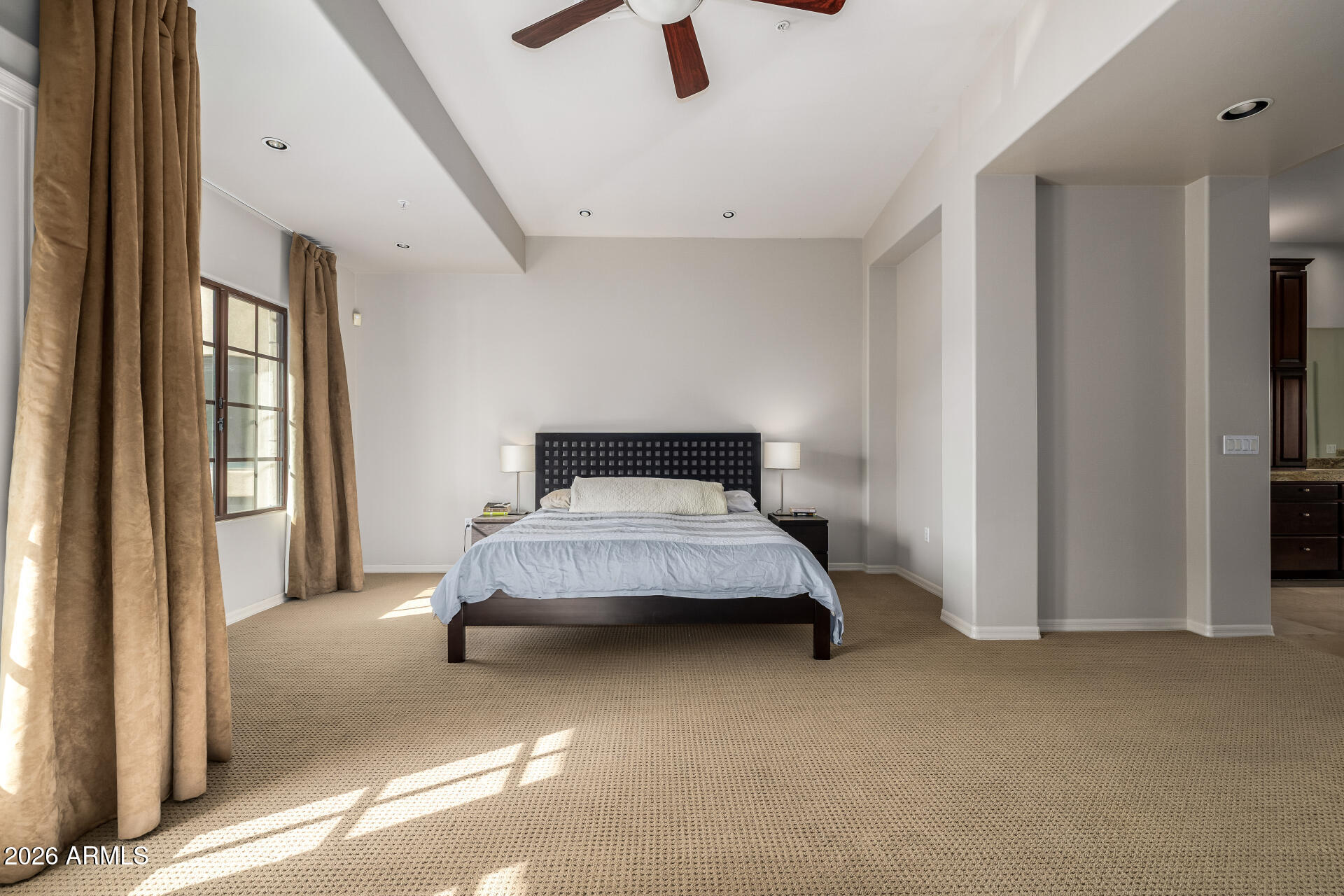 4430 North 22nd Street, Unit 3 Phoenix, AZ 85016 - Photo 22 of 68 a spacious bedroom with a bed and a large window