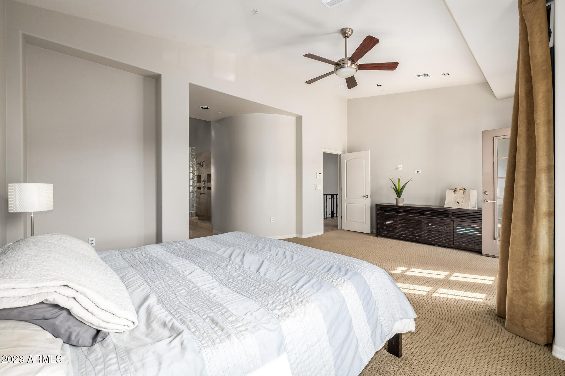 4430 North 22nd Street, Unit 3 Phoenix, AZ 85016 - Photo 23 of 68 a spacious bedroom with a bed and a ceiling fan