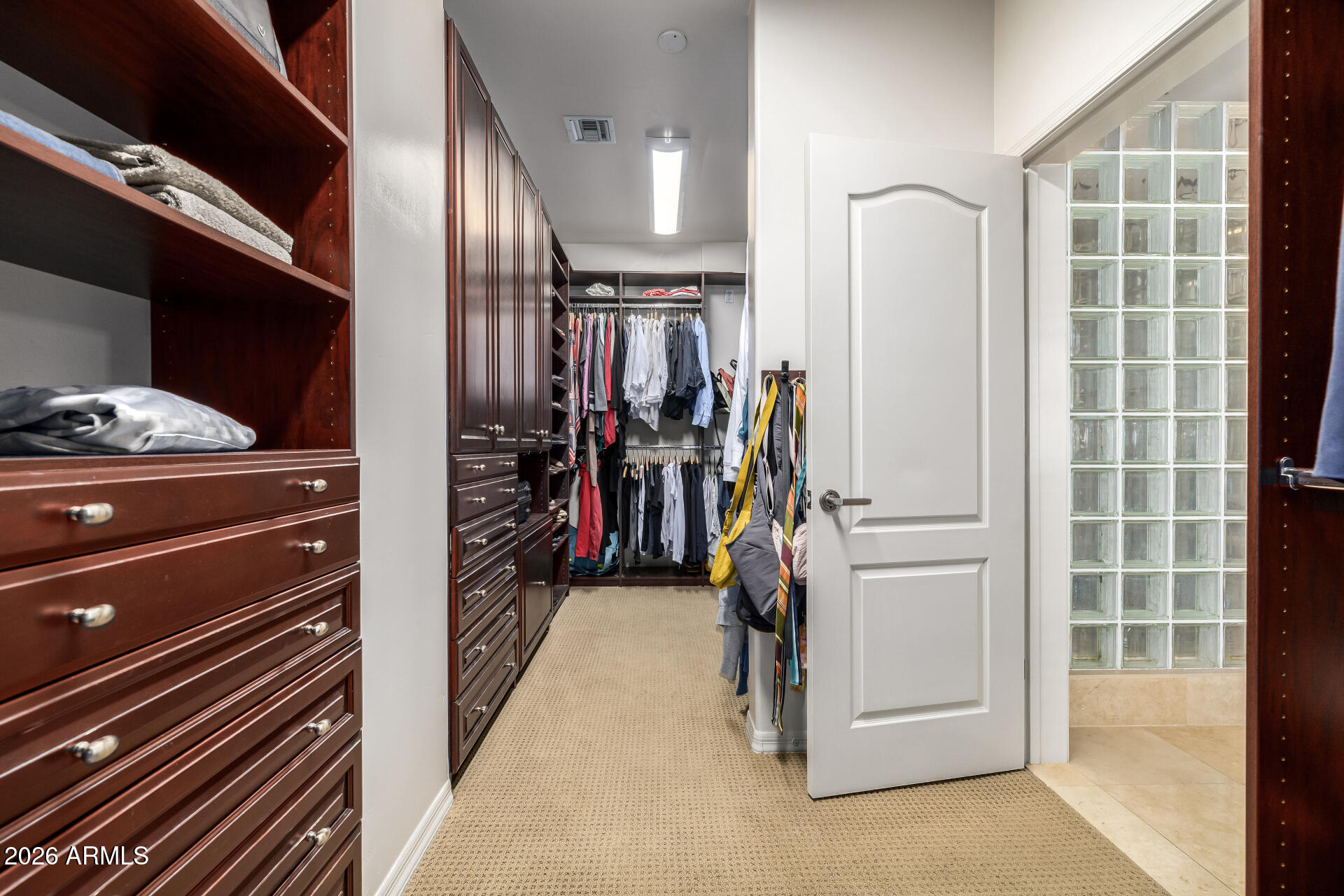 4430 North 22nd Street, Unit 3 Phoenix, AZ 85016 - Photo 27 of 68 a view of walk in closet with clothes and shoes