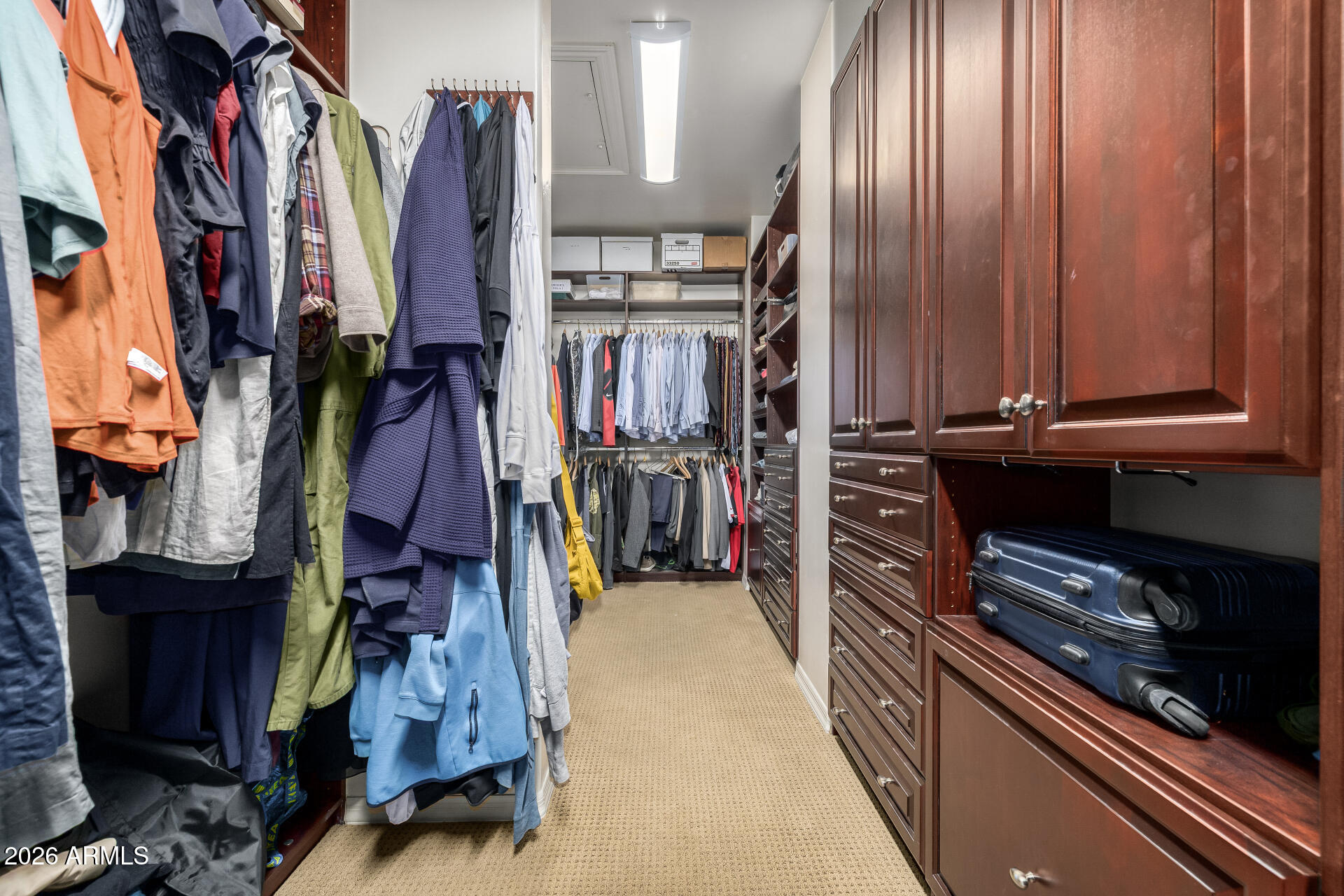 4430 North 22nd Street, Unit 3 Phoenix, AZ 85016 - Photo 28 of 68 a view of walk in closet with clothes and shoes