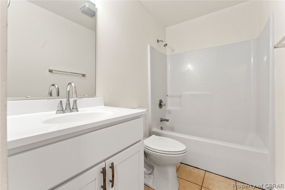 1509 Tallent Town Road Warsaw, VA 22572 - Photo 22 of 31 Full bathroom with washtub / shower combination, vanity, toilet, and tile floors
