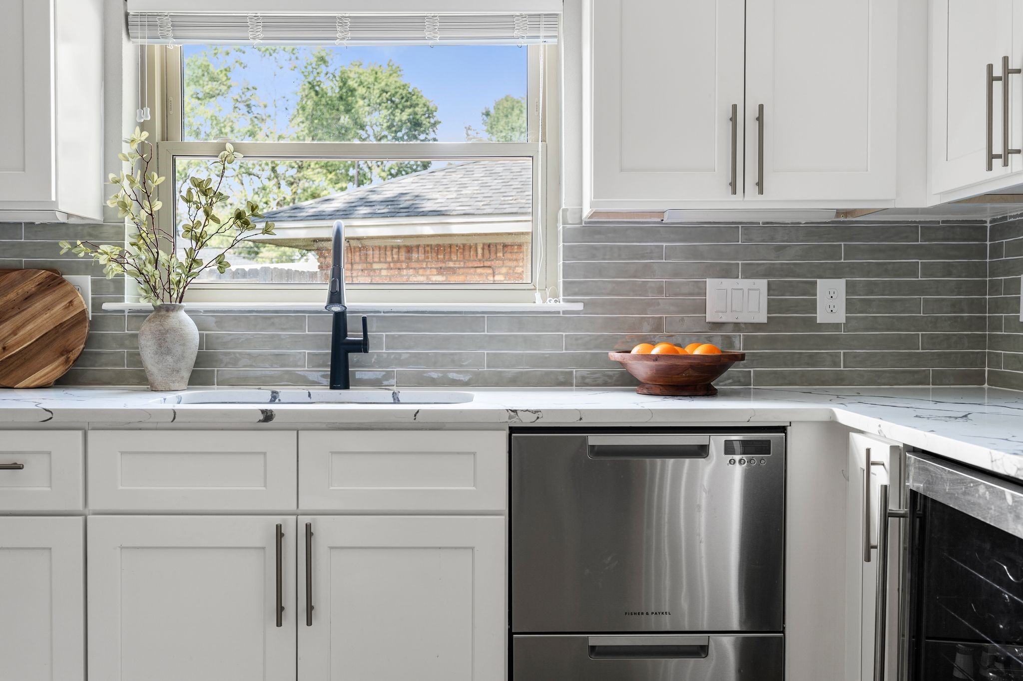 4423 Apollo Street Houston, TX 77018 - Photo 12 of 34 A double paned window overlooking the driveway makes it easy to see little ones ride tricycles while at the kitchen sink.