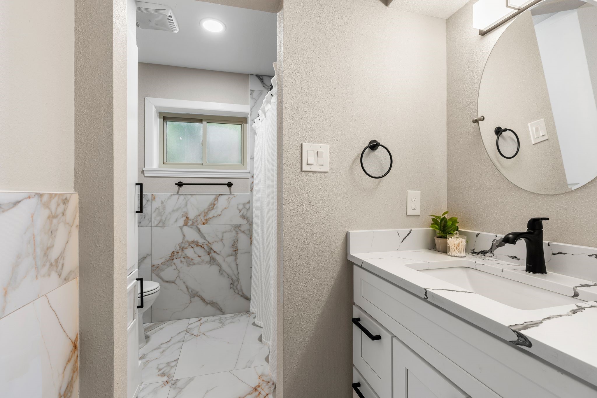 4423 Apollo Street Houston, TX 77018 - Photo 20 of 34 Stylishly updated guest bath with modern finishes designed for both comfort and convenience.