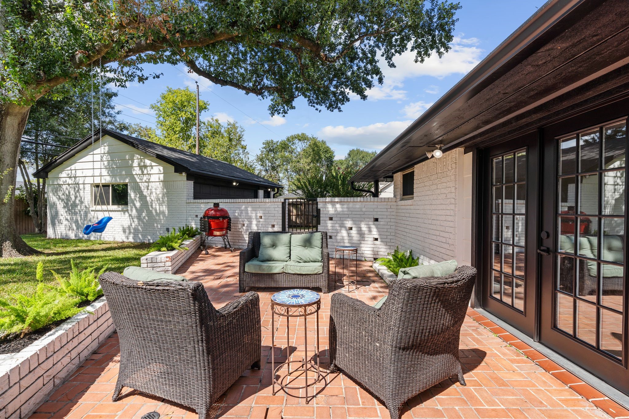 4423 Apollo Street Houston, TX 77018 - Photo 25 of 34 Patio area steps from the french doors perfect for seamless indoor outdoor living and entertaining.
