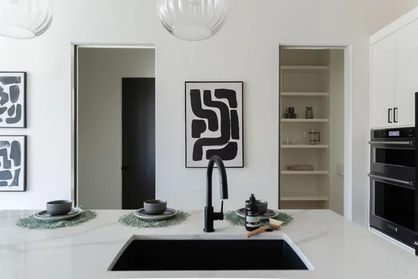 a kitchen with a refrigerator and a stove