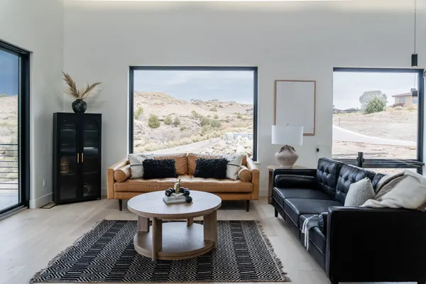 a living room with furniture and a large window