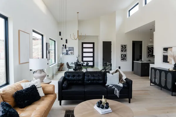 a living room with furniture and wooden floor