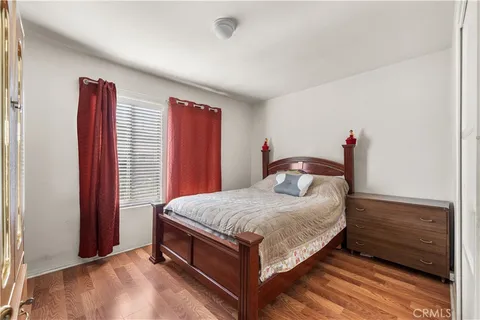 a bedroom with a bed and a view of bathroom