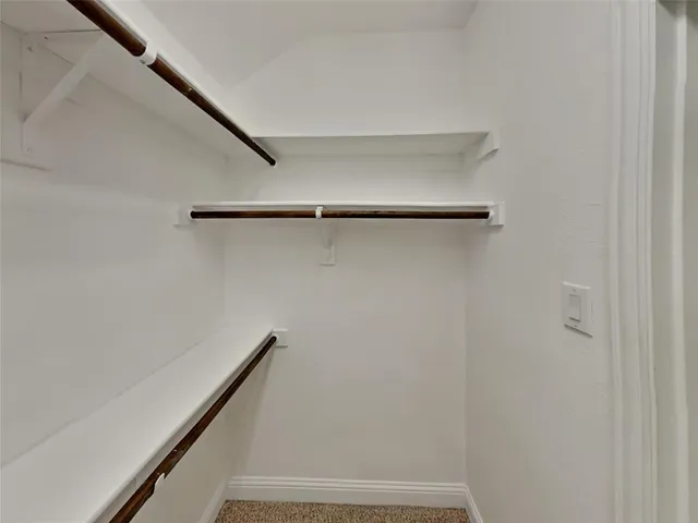a view of staircase with wooden floor