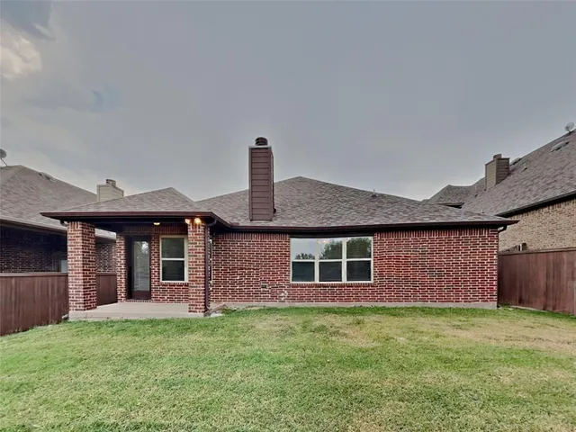 a swimming pool with outdoor seating and barbeque oven