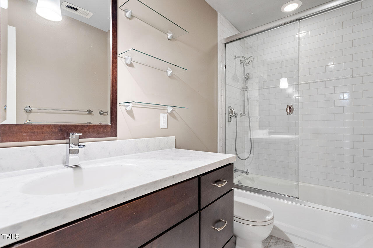 3124 Coachman's Way Durham, NC 27705 - Photo 19 of 30 a bathroom with a sink a toilet and shower