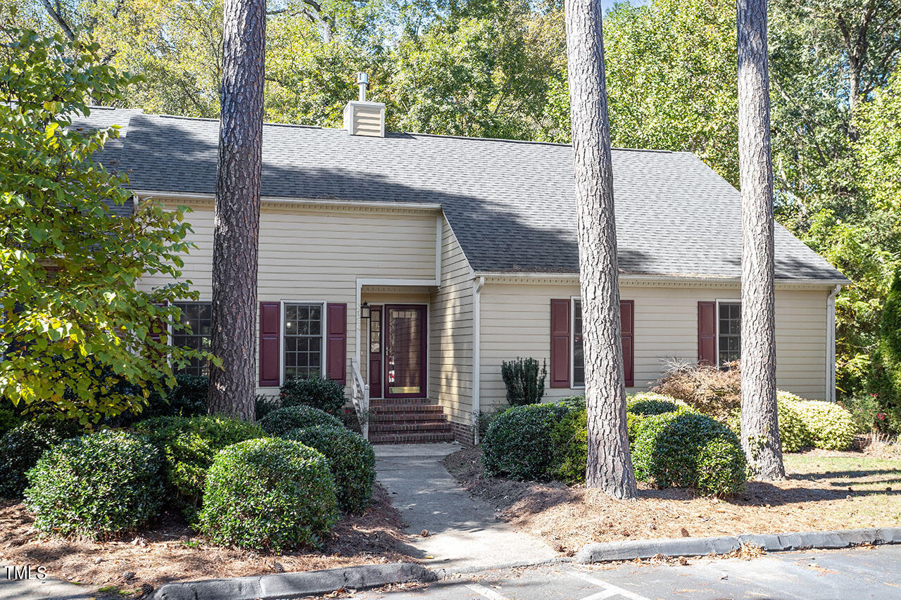 3124 Coachman's Way Durham, NC 27705 - Photo 2 of 30 a view of a white house with a small yard plants and large tree