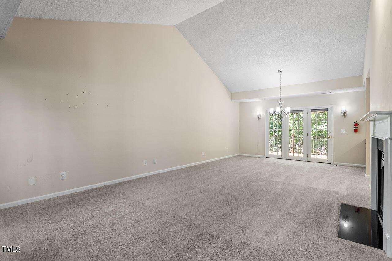 3124 Coachman's Way Durham, NC 27705 - Photo 7 of 30 an empty room with windows and yard