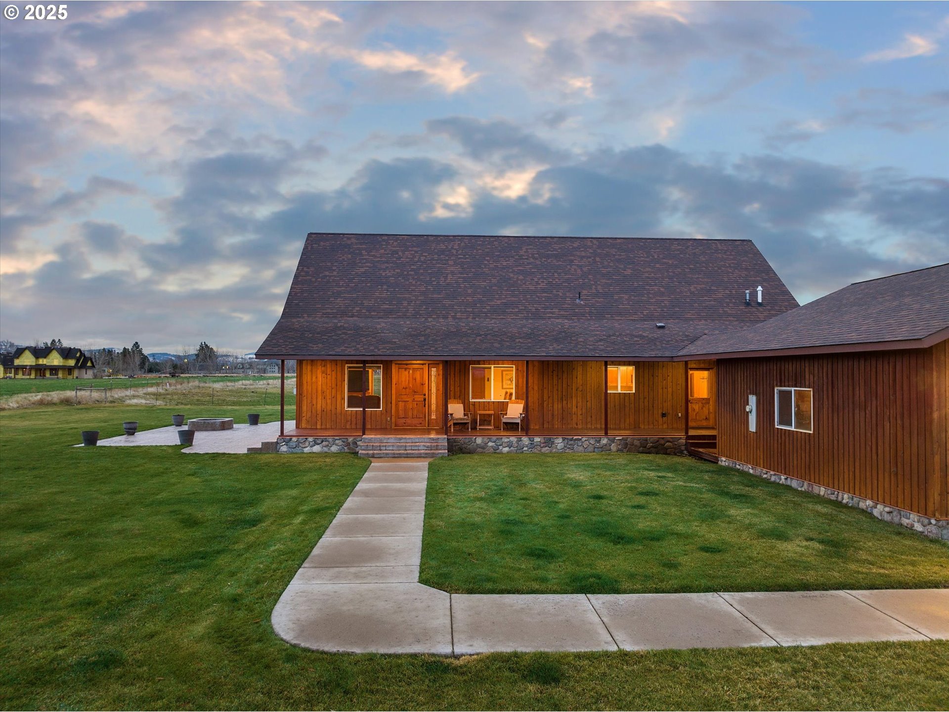 62123 Chandler Loop La Grande, OR 97850 - Photo 13 of 48 a view of a house with a yard potted plants and large tree