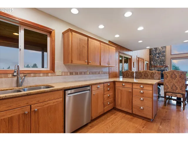 a kitchen with sink and cabinets