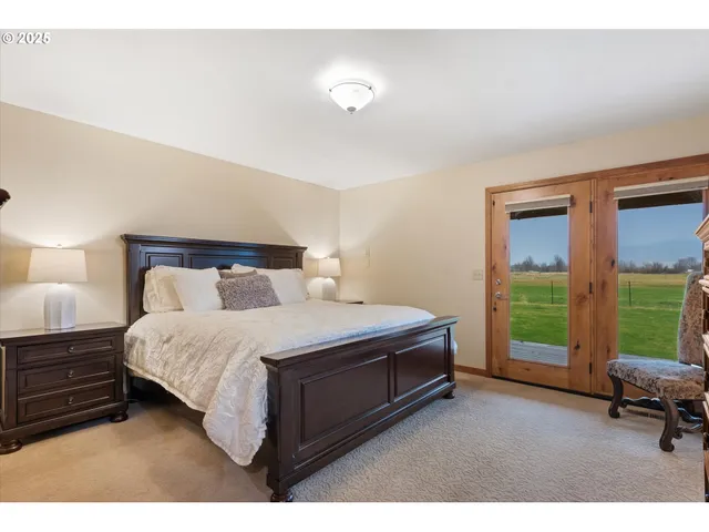 a bedroom with a bed and a chair