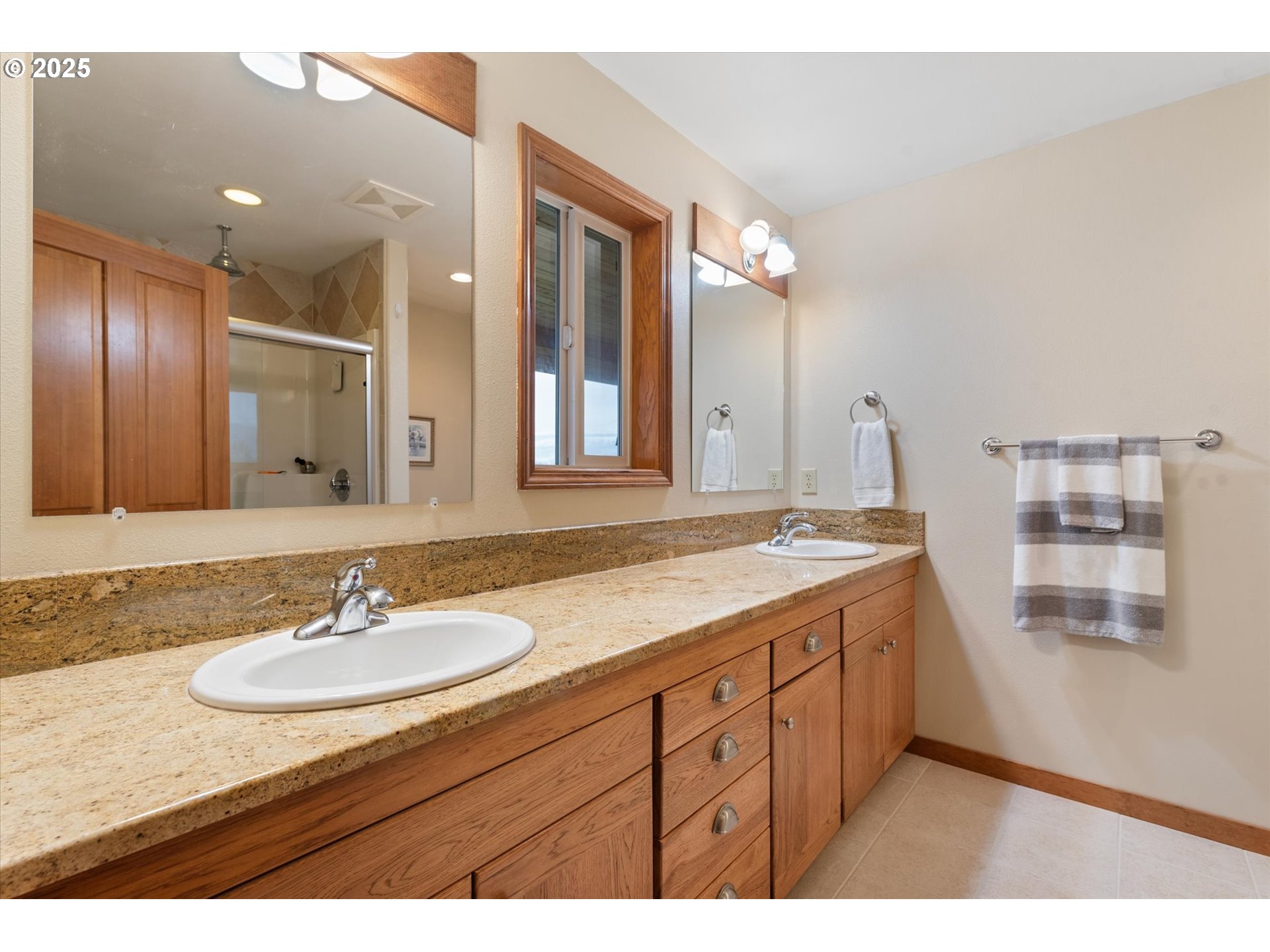 62123 Chandler Loop La Grande, OR 97850 - Photo 27 of 48 a bathroom with a sink double vanity granite and a mirror