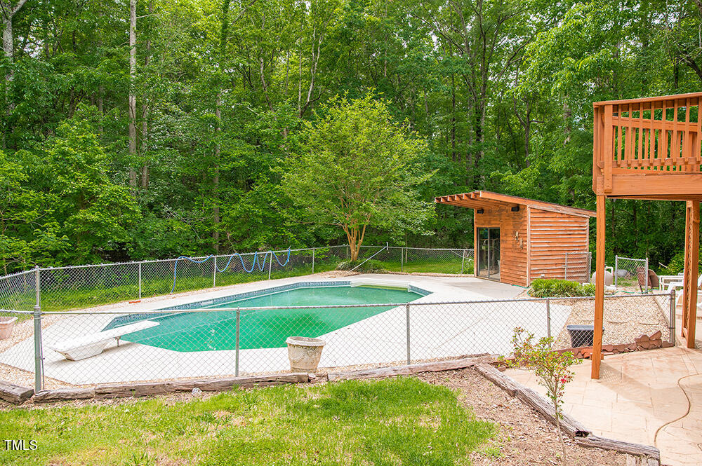 1891 Berry Pearce Road Timberlake, NC 27583 - Photo 54 of 54 a view of a backyard with swimming pool