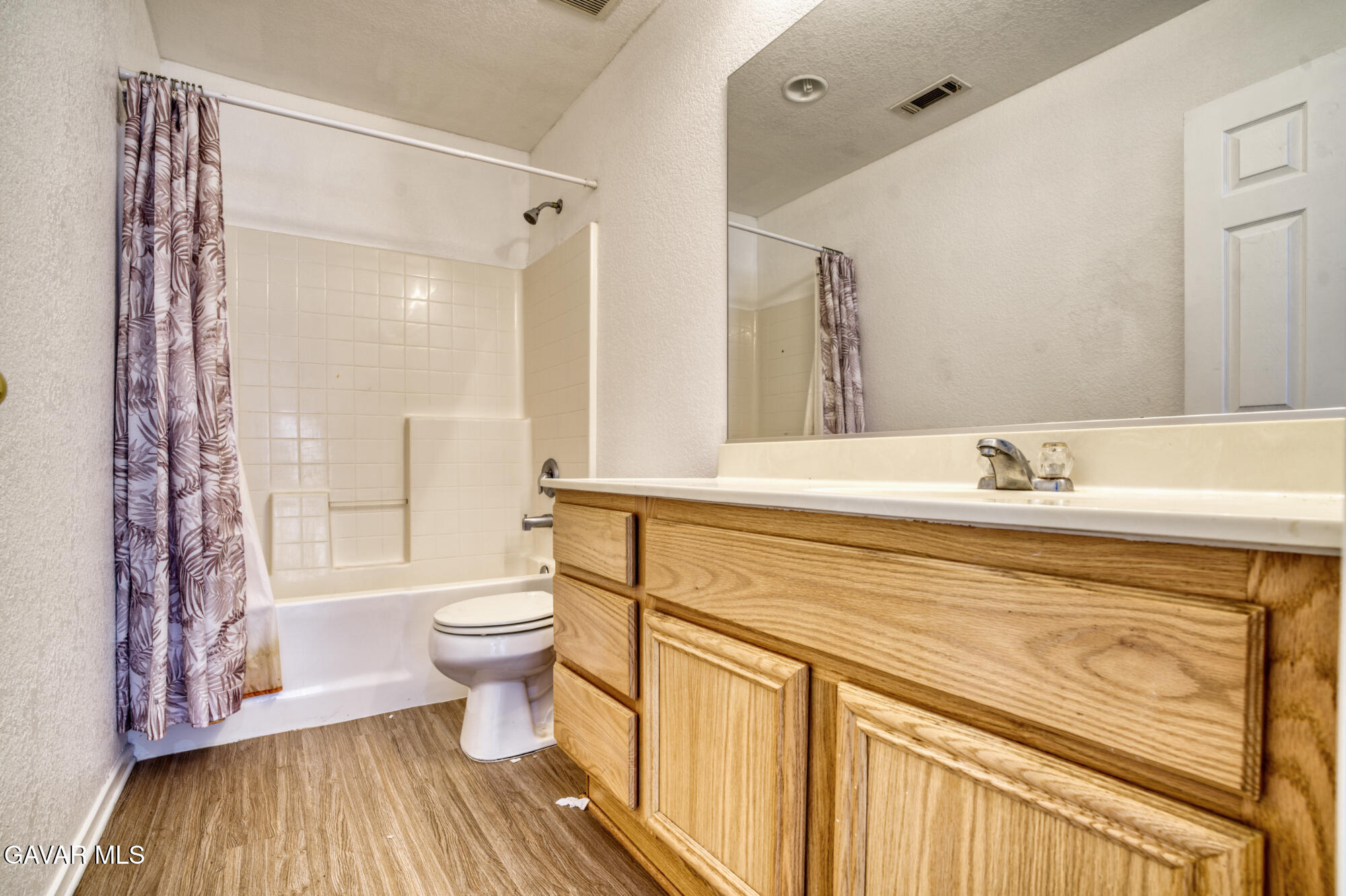 45444 Spahn Lane Lancaster, CA 93535 - Photo 11 of 13 a bathroom with a sink a toilet and shower