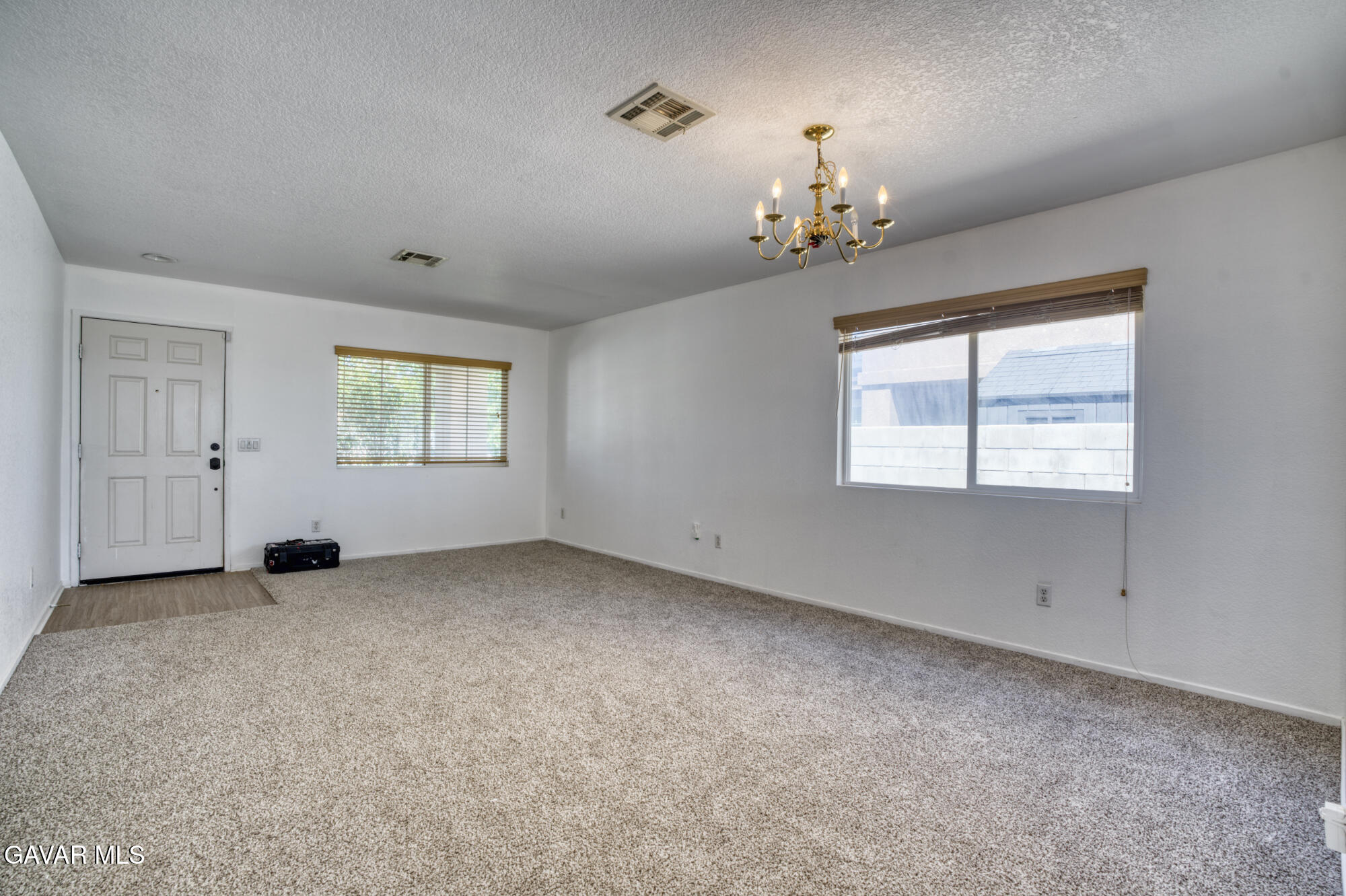 45444 Spahn Lane Lancaster, CA 93535 - Photo 5 of 13 a view of an empty room with a window