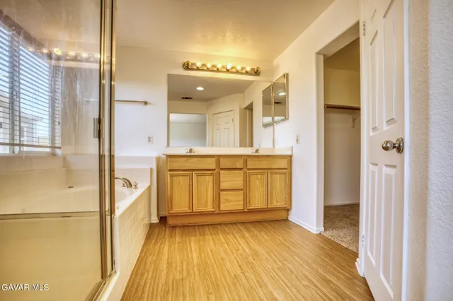 an empty room with a empty space and windows