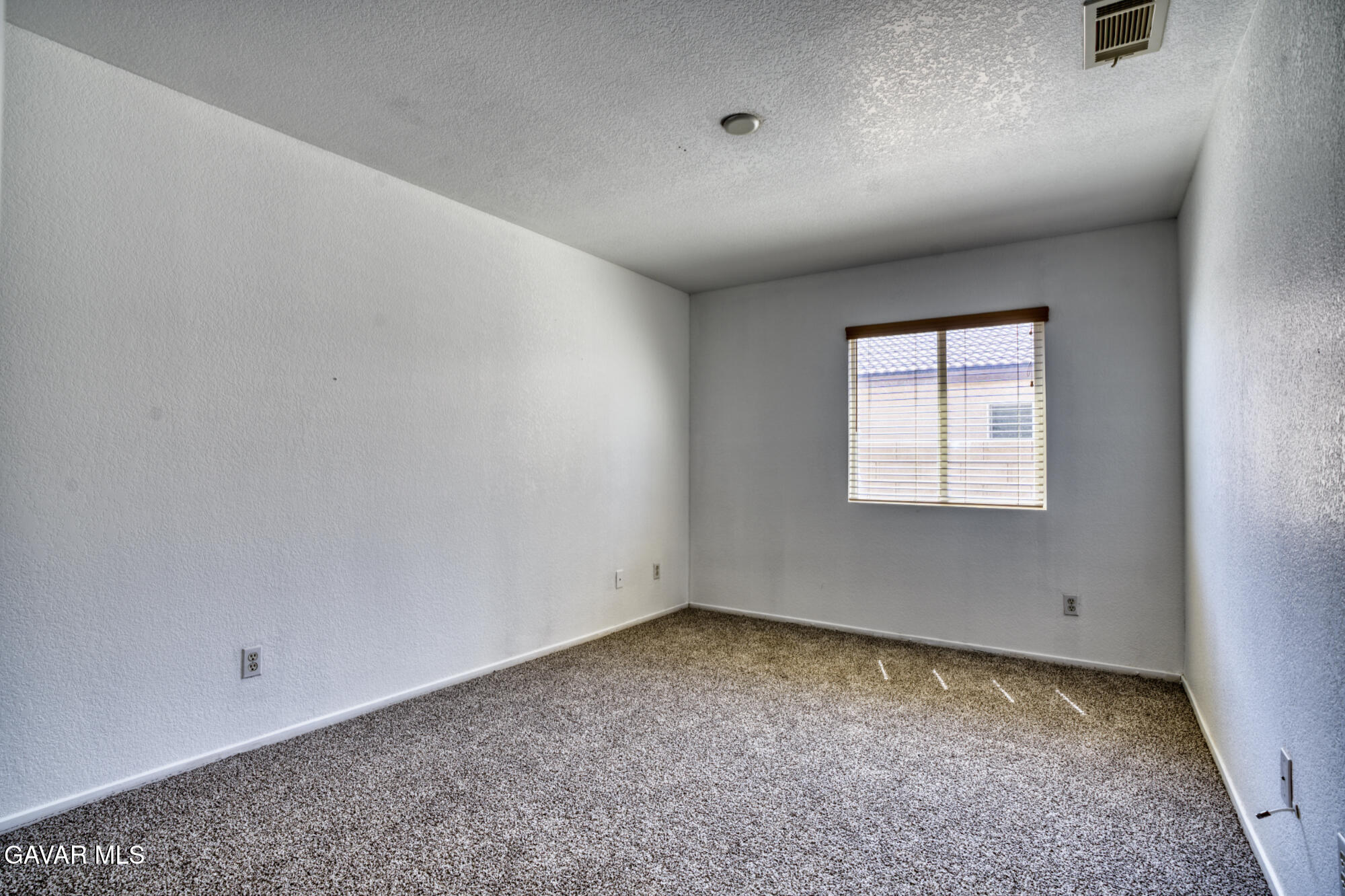 45444 Spahn Lane Lancaster, CA 93535 - Photo 10 of 13 an empty room with a empty space and windows