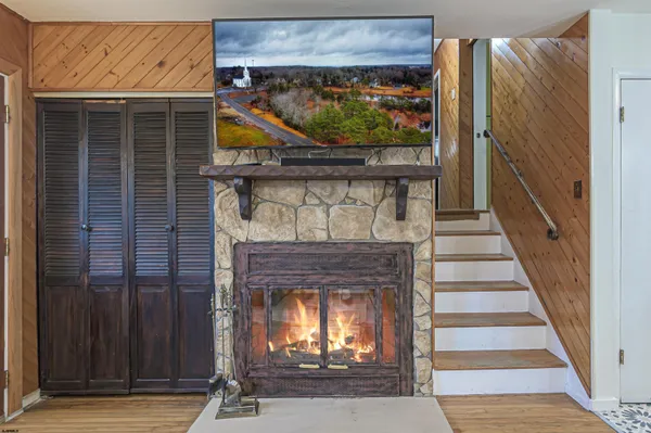 a view of fireplace with wooden floor