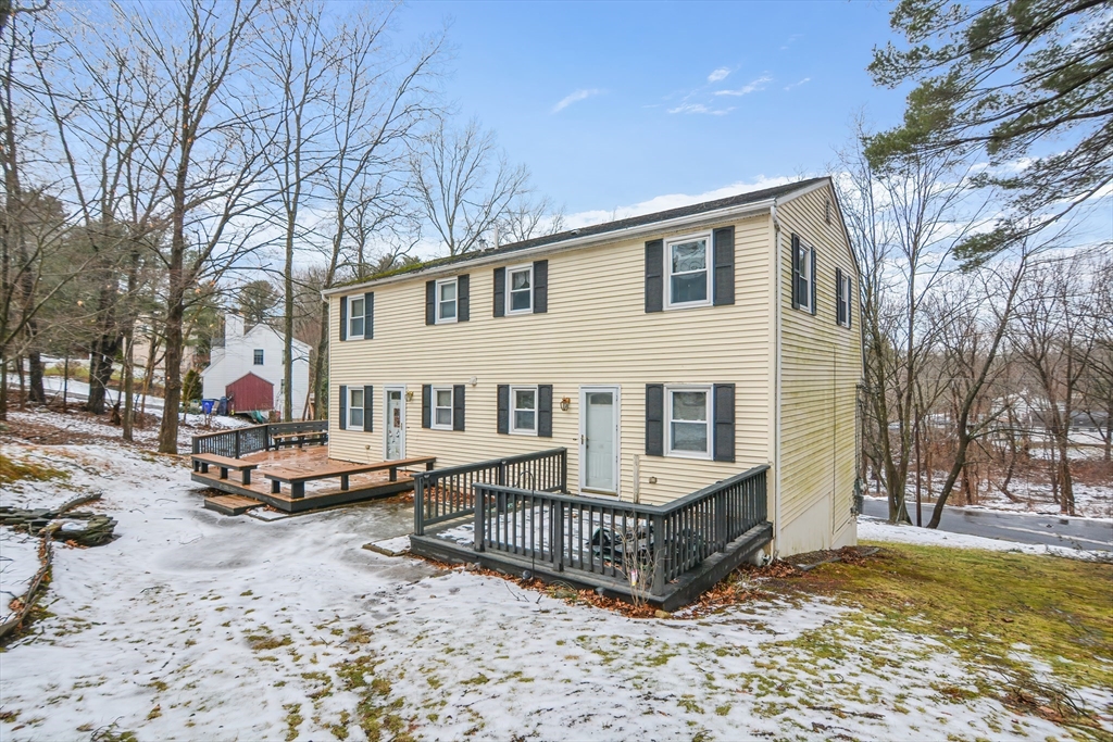 2 Hartness Road, Unit A Sutton, MA 01590 - Photo 16 of 37 a view of a house with a yard and sitting area