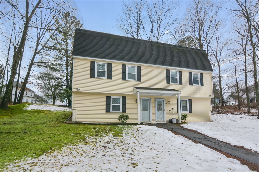 2 Hartness Road, Unit A Sutton, MA 01590 - Photo 2 of 37 a front view of a house with a yard