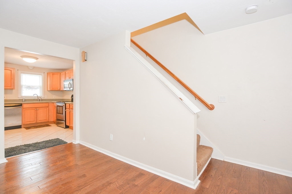 2 Hartness Road, Unit A Sutton, MA 01590 - Photo 24 of 37 a view of a hallway with wooden floor and entryway