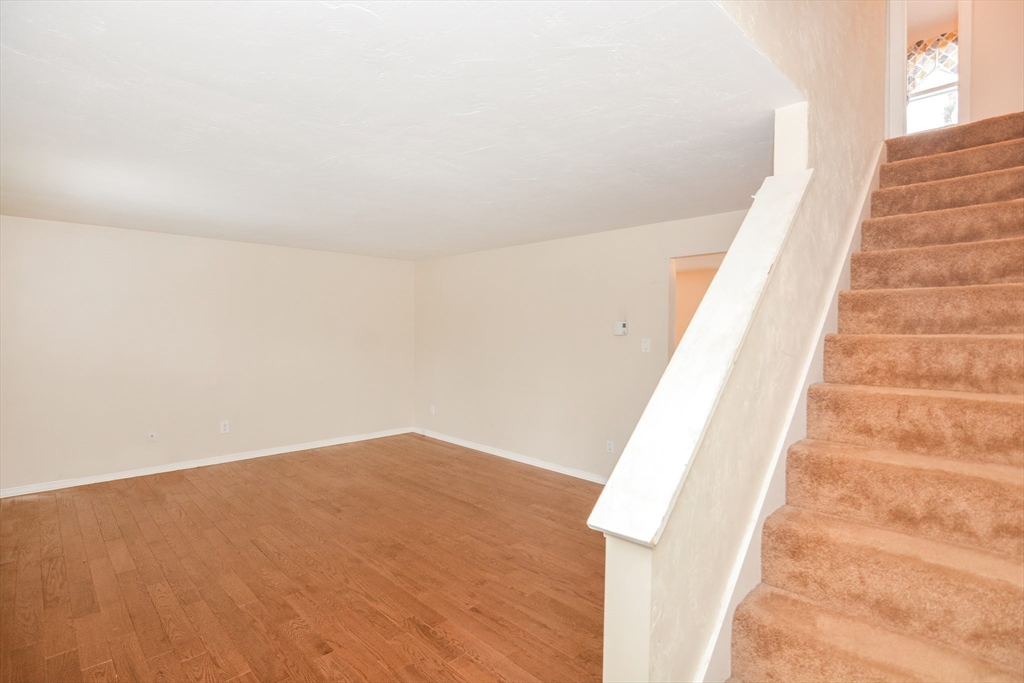 2 Hartness Road, Unit A Sutton, MA 01590 - Photo 25 of 37 a view of staircase with white walls