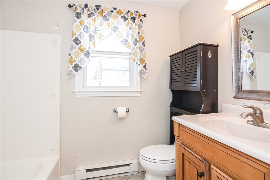 2 Hartness Road, Unit A Sutton, MA 01590 - Photo 27 of 37 a bathroom with a sink toilet and window