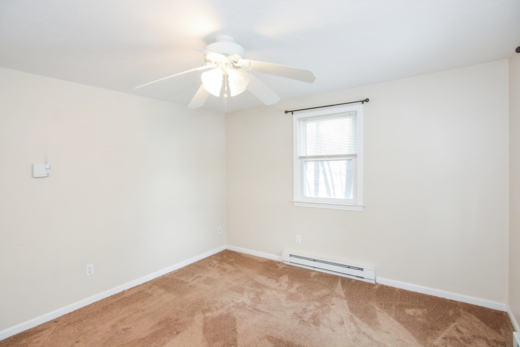 2 Hartness Road, Unit A Sutton, MA 01590 - Photo 34 of 37 an empty room with windows and fan