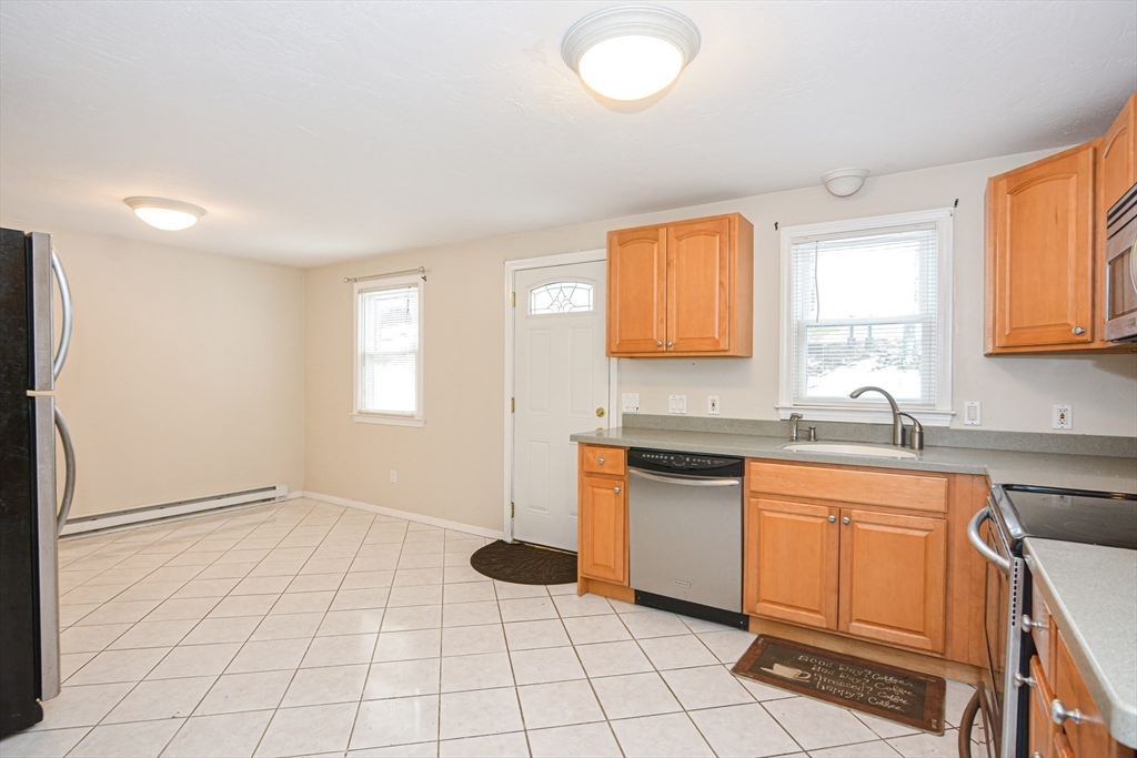 2 Hartness Road, Unit A Sutton, MA 01590 - Photo 8 of 37 a kitchen with a sink cabinets and window