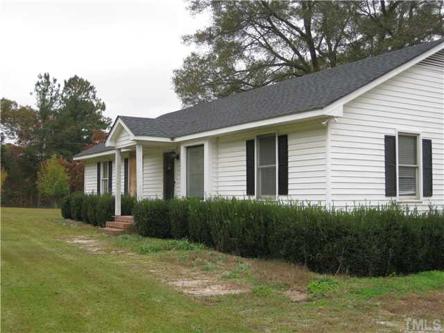 3501 Leonard Road Raleigh, NC 27610 - Photo 2 of 3 a front view of a house with garden