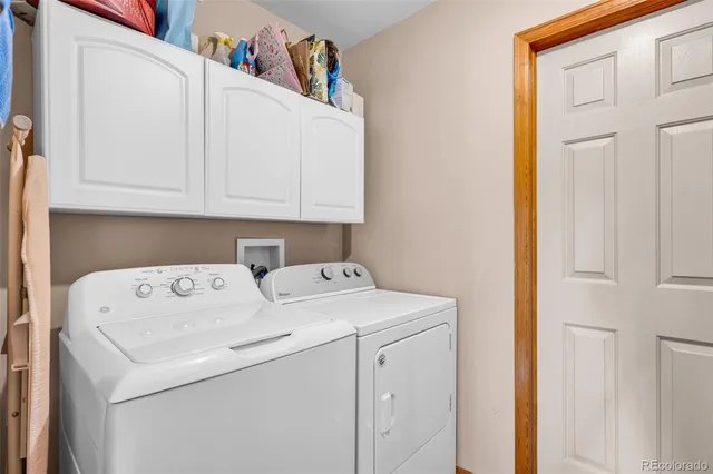a view of storage and utility room with washer and dryer