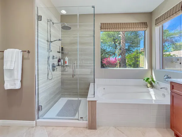 a view of a patio with table and chairs and potted plants
