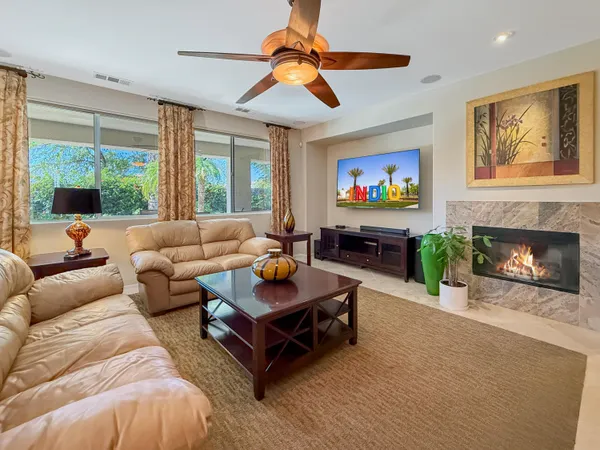 a living room with furniture and a window