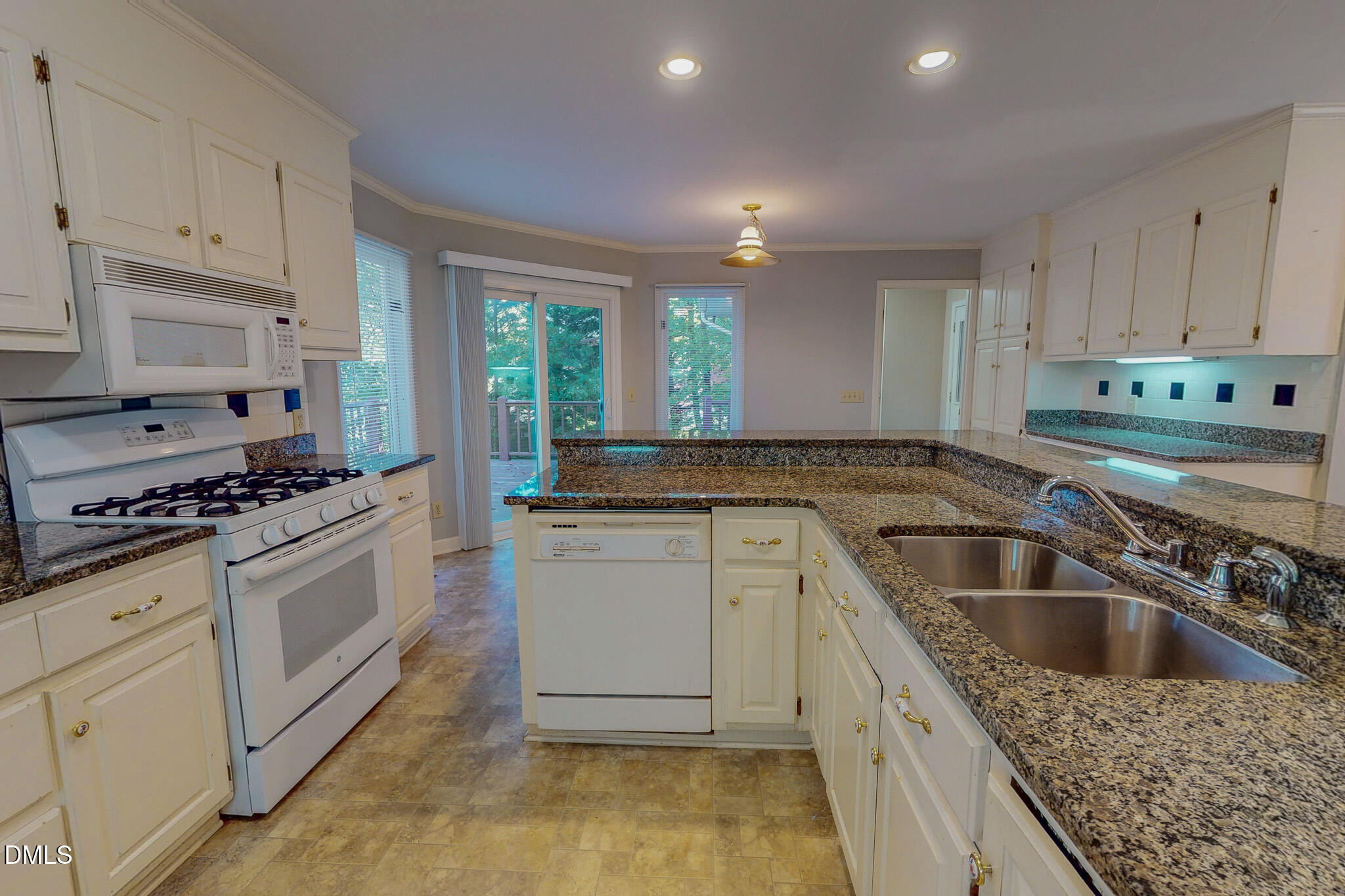 11 Denada Path Roxboro, NC 27574 - Photo 46 of 62 a kitchen with granite countertop a sink stove and cabinets