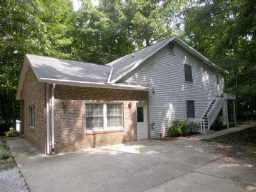 6101 Davis Road Waxhaw, NC 28173 - Photo 1 of 2 a front view of a house with a garden
