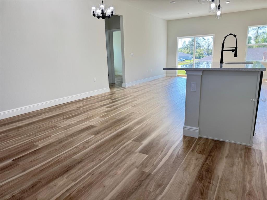2336 Southwest 168th Loop Ocala, FL 34473 - Photo 12 of 40 a view of a room with wooden floor and a window