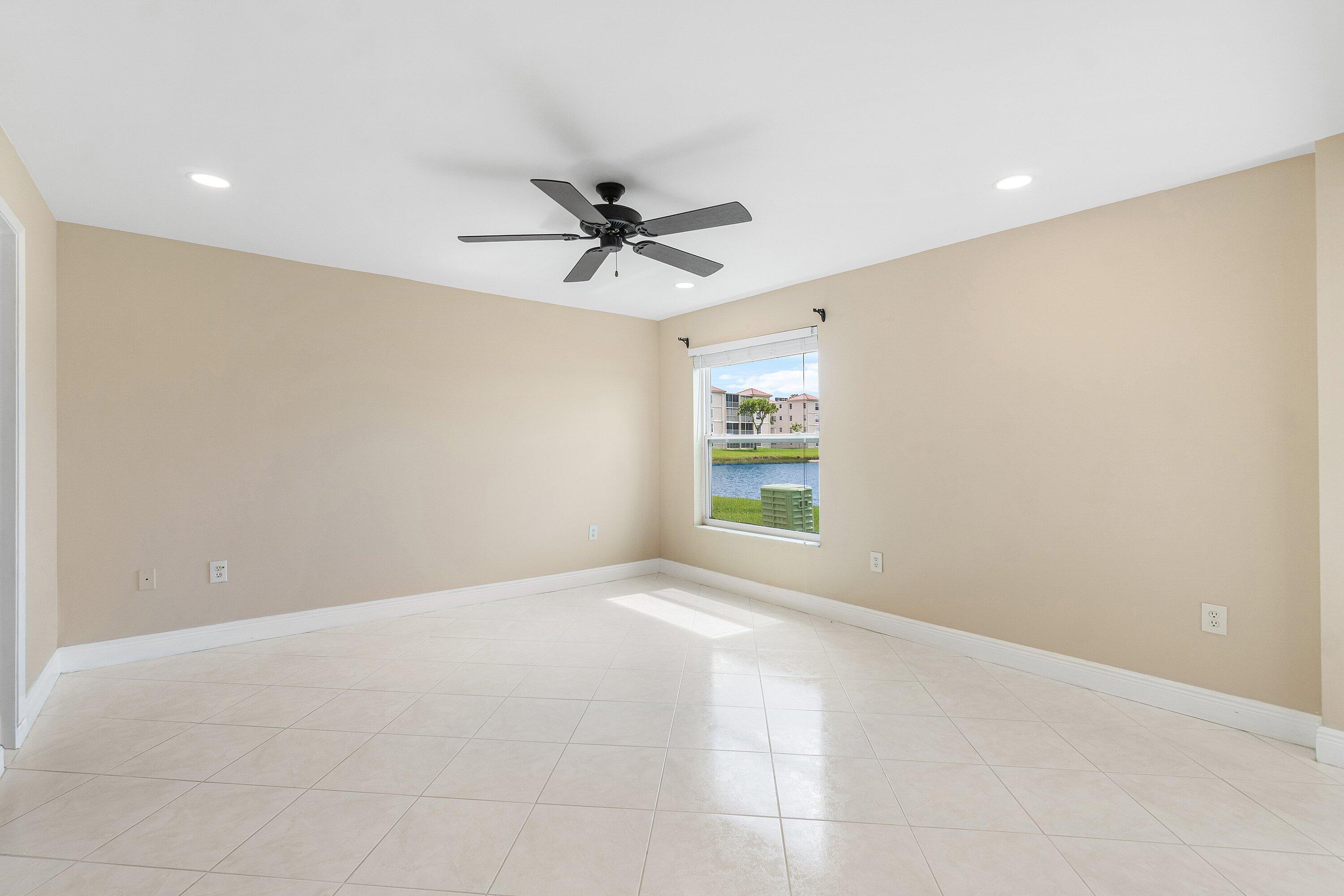 14096 Huntington Pointe Drive, Unit 106 Delray Beach, FL 33484 - Photo 35 of 47 a view of an empty room with a window