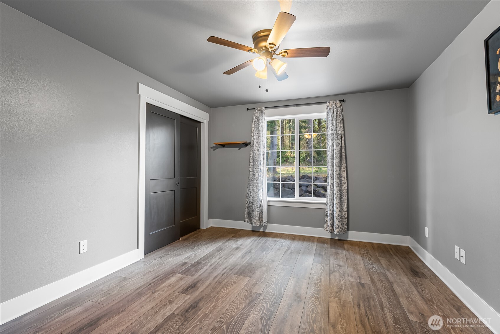 159 Salzer Road Centralia, WA 98531 - Photo 13 of 40 an empty room with wooden floor and windows