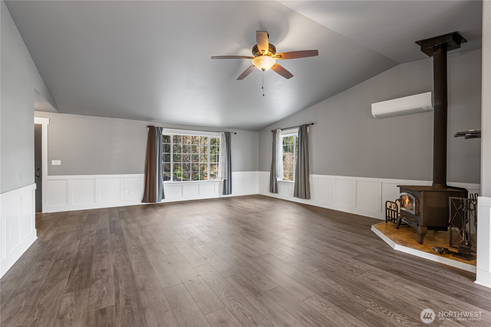 159 Salzer Road Centralia, WA 98531 - Photo 4 of 40 a view of an empty room with window and wooden floor