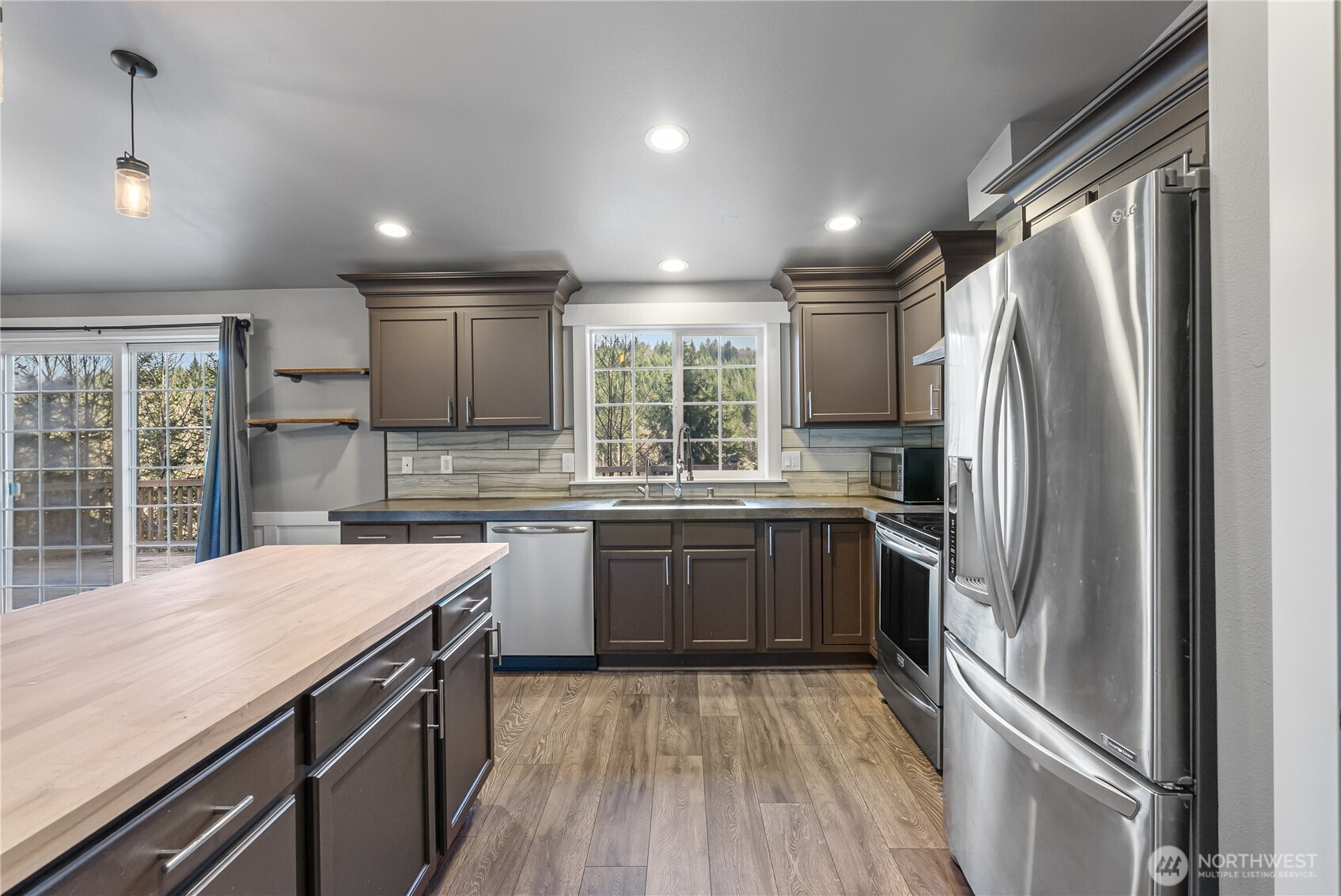 159 Salzer Road Centralia, WA 98531 - Photo 8 of 40 a kitchen with a refrigerator a sink and cabinets