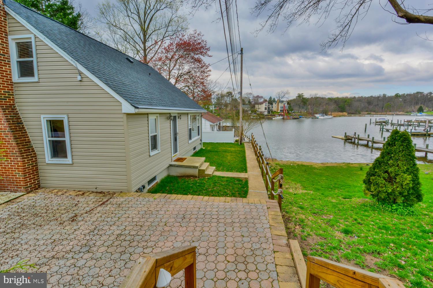 7732 West A W Shore Road Pasadena, MD 21122 - Photo 4 of 43 Large paver patio and deck for entertaining
